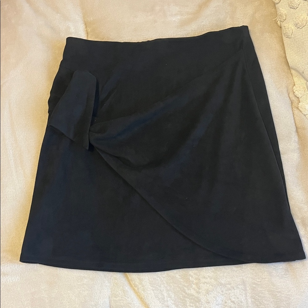 Tight and short black skirt